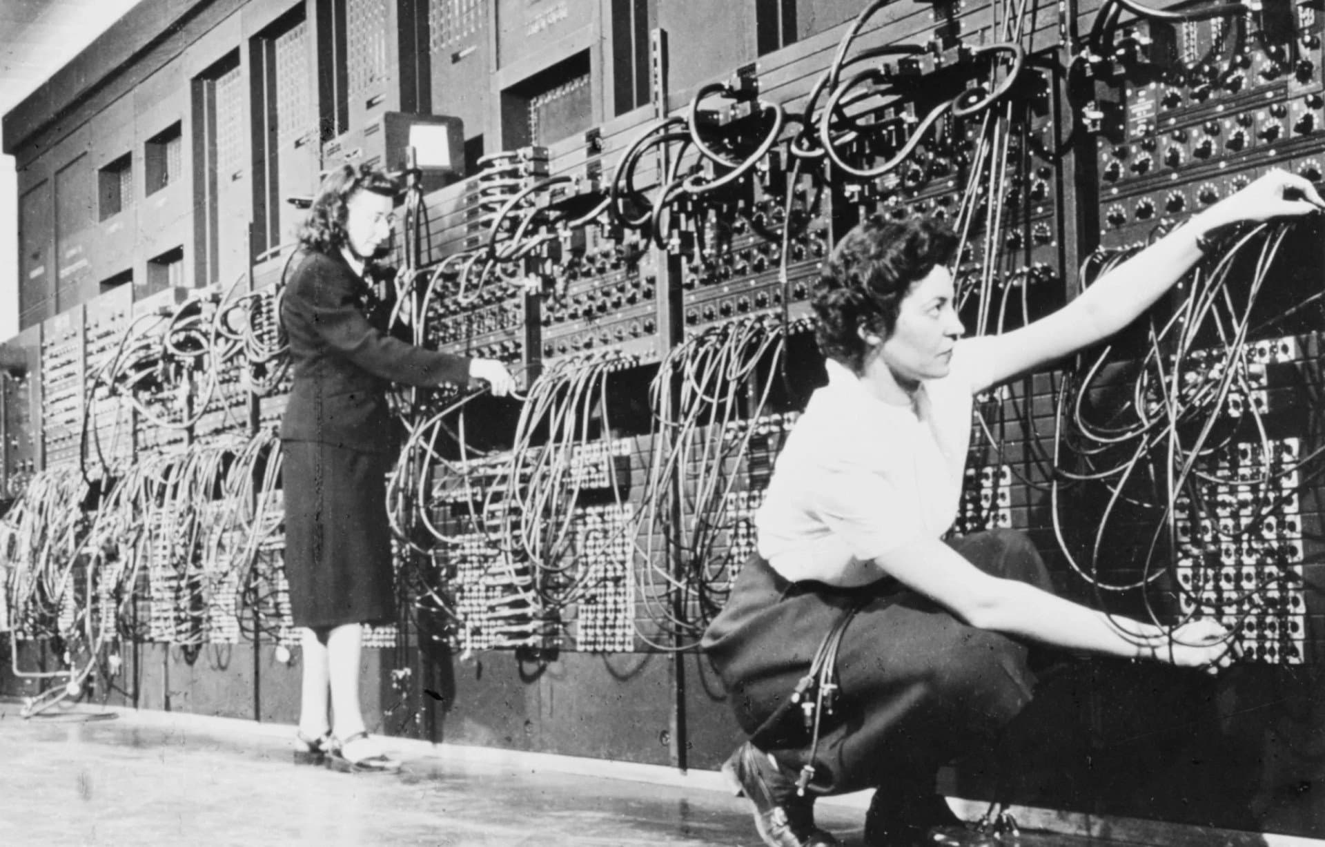 Programmers Marlyn Wescoff and Ruth Lichterman at the ENIAC, the first computer, introduced in 1947 — a room-sized array of vacuum tubes and patch cables