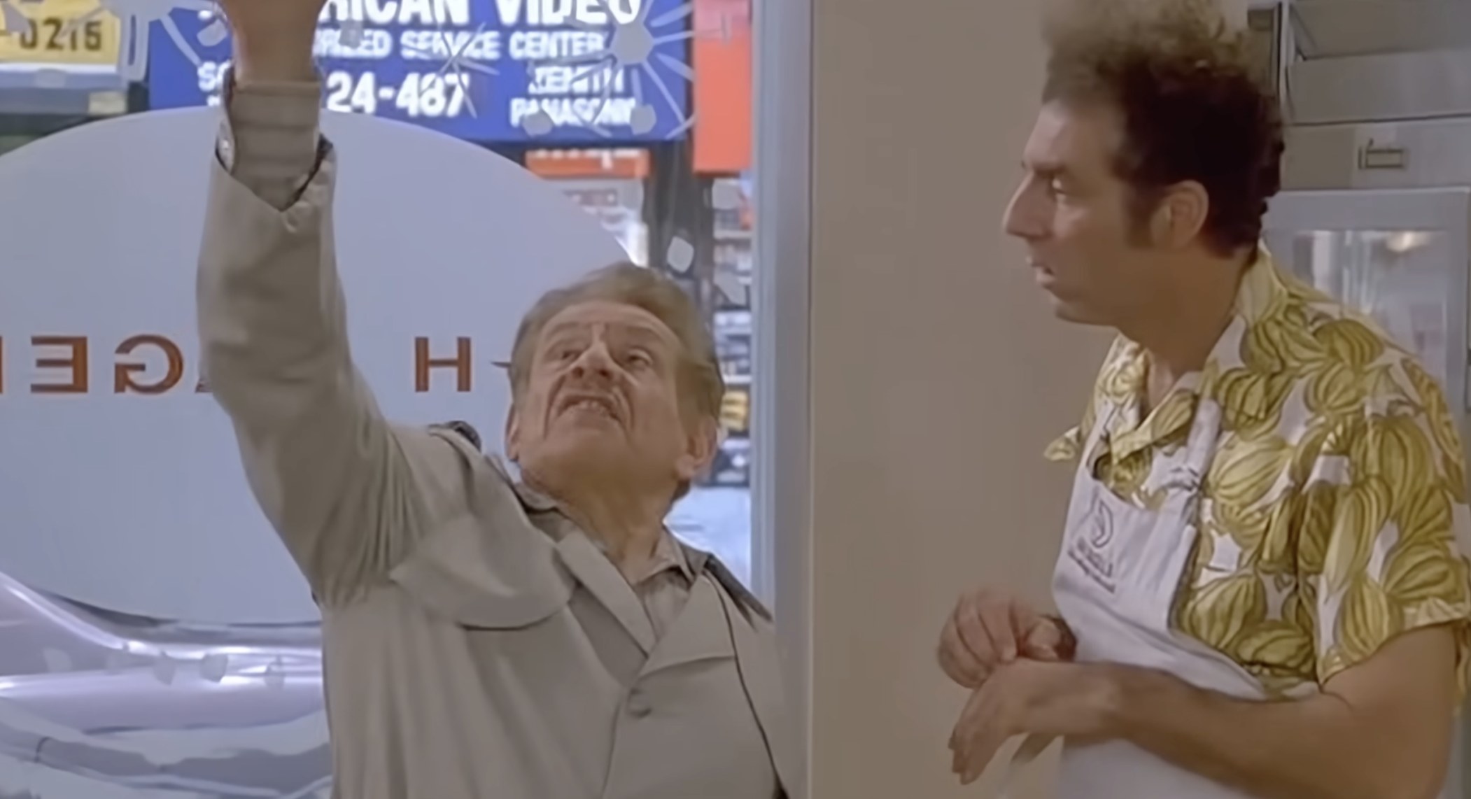 Frank Costanza and Cosmo Kramer in the Seinfeld episode 'The Strike' — Frank gesturing dramatically as he tells the origin story of Festivus